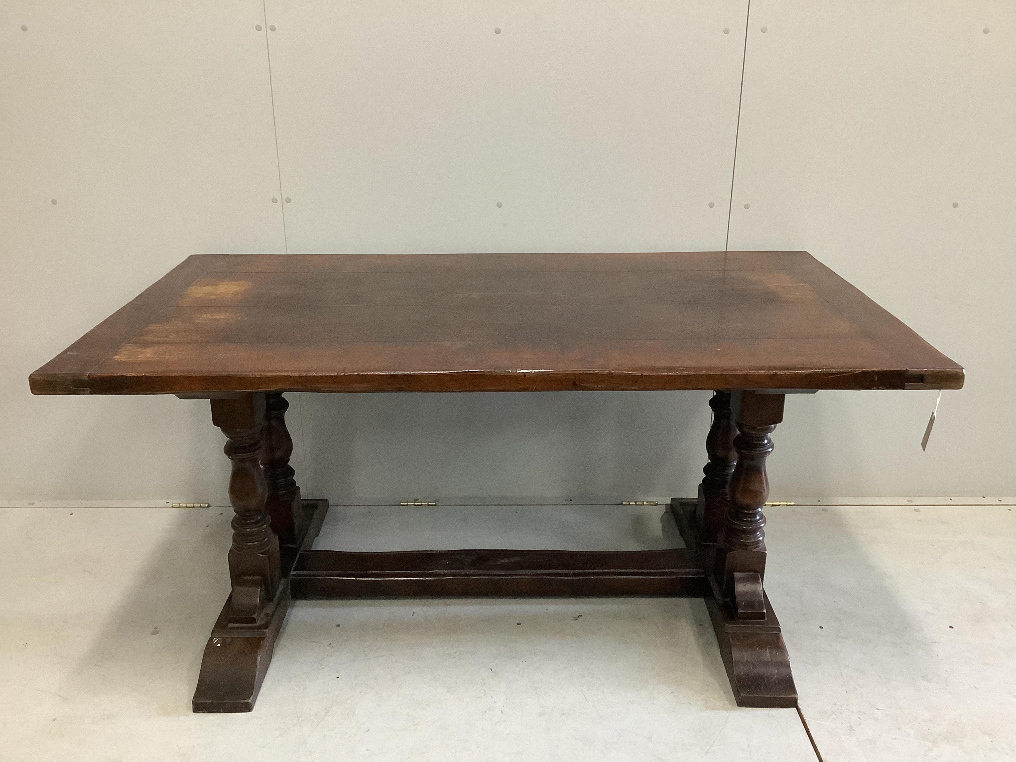 An 18th century style rectangular oak refectory dining table, width 167cm, depth 91cm, height 77cm. Condition - fair, top faded in several places